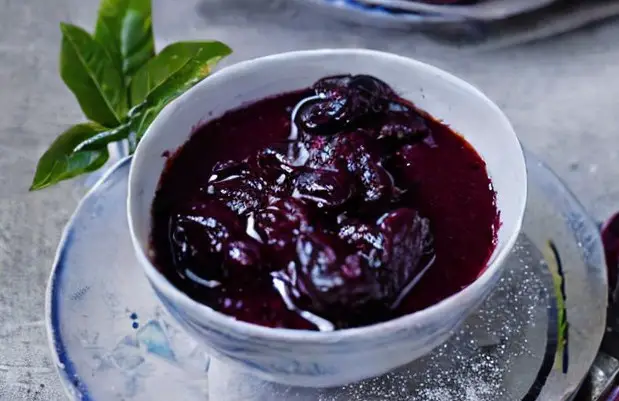 Stewed damsons in a bowl